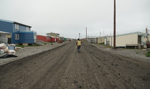 Coastal Hazards scientist surveying in the community of Point Hope, Alaska